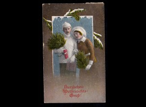 Foto-AK Weihnachten: Ehepaar in Winterkleidung mit Tannengrün GILDEHAUS 24.12.21